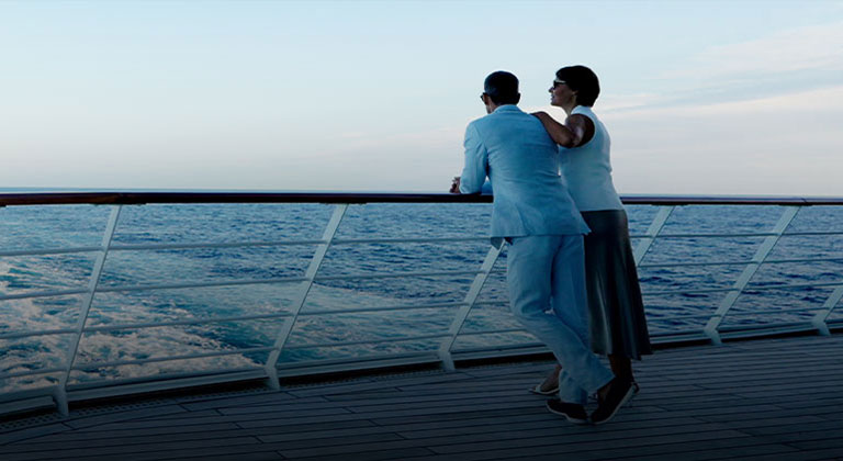 couple standing together overlooking the ocean