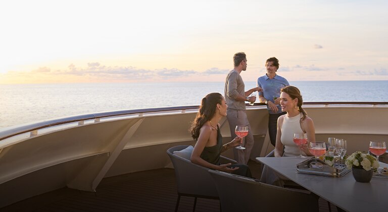 large balcony aboard a cruise ship overlooking the ocean
